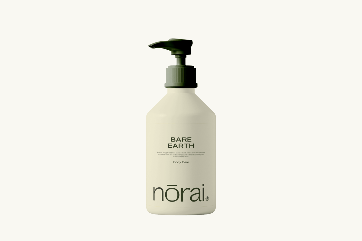 Lotion bottle labeled 'Bare Earth' by 'norai' on a white background