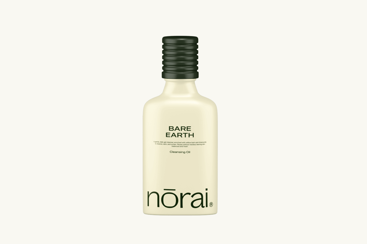 Bottle of norai Bare Earth Cleansing Oil on a white background