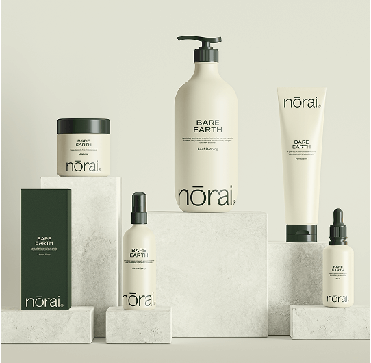 Collection of norai Bare Earth skincare products on a neutral background
