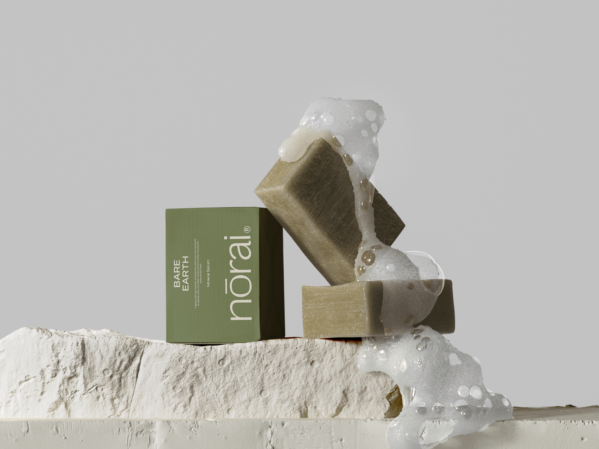 Two soap bars with suds and a green box labeled 'näorai' on a light gray background.