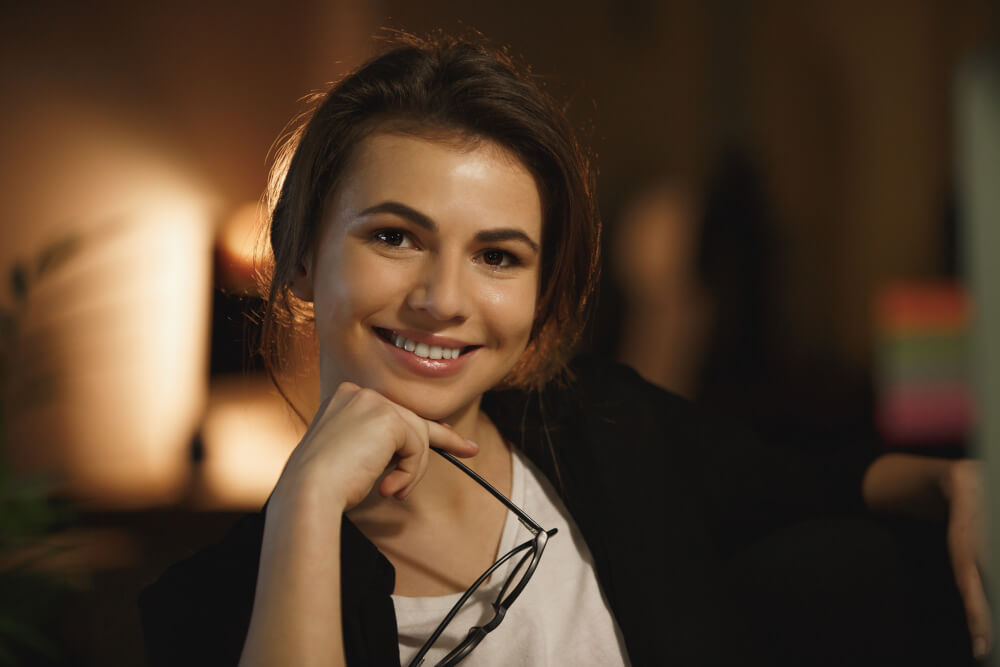 a woman with a glass