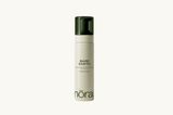 Skincare bottle labeled 'Bare Earth' by 'nora' on a white background
