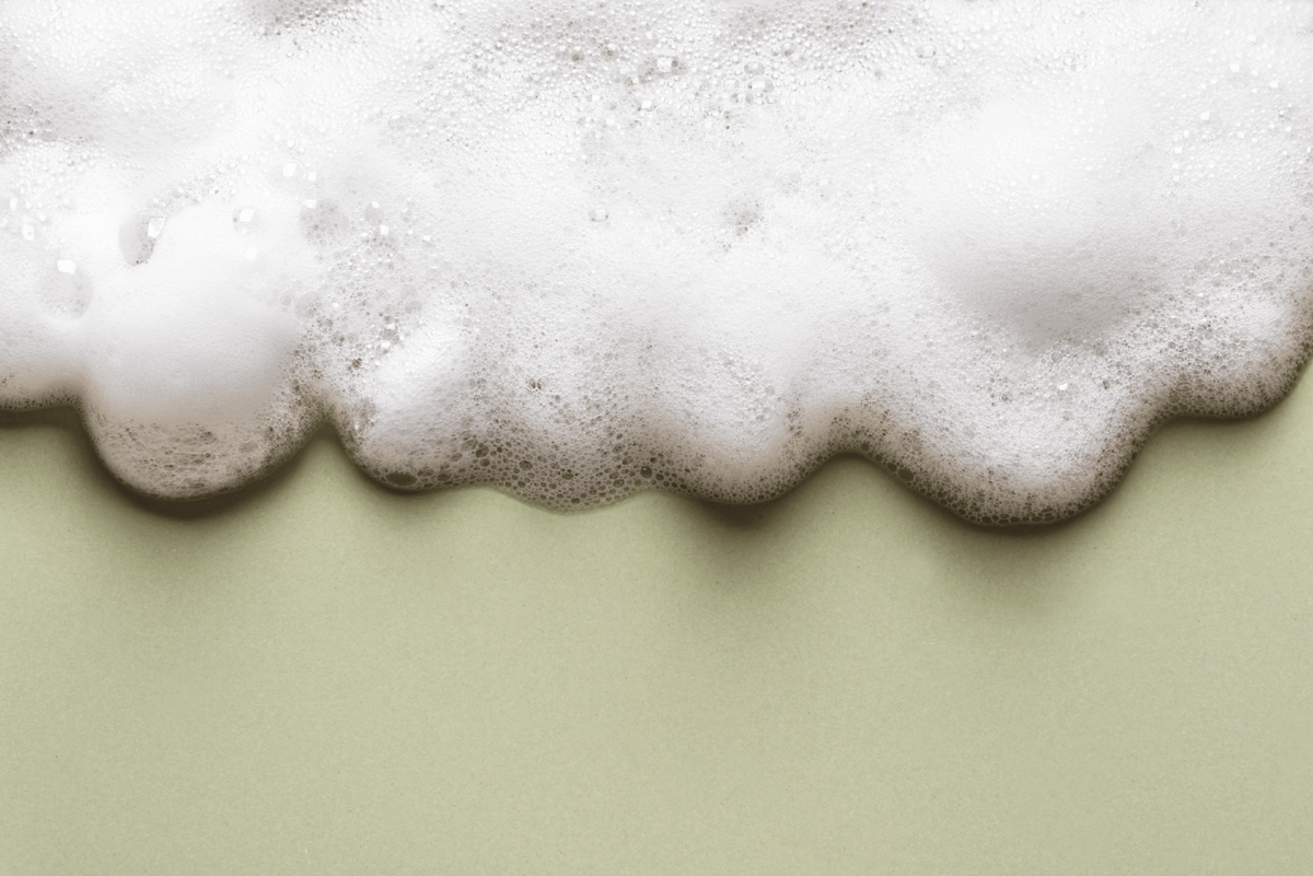 Foamy soapuds on a light green background