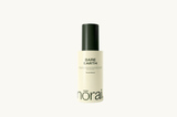 Norai Bare Earth facial spray bottle on a white background